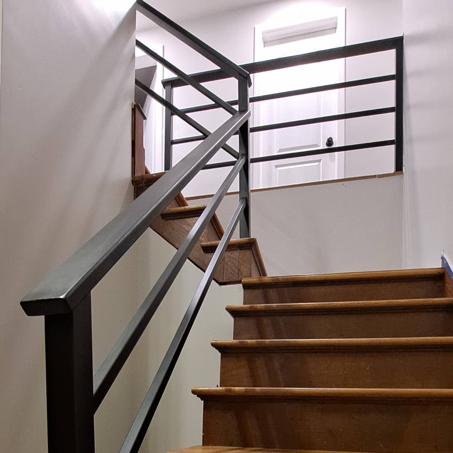 Modern interior stair railing with horizontal bars